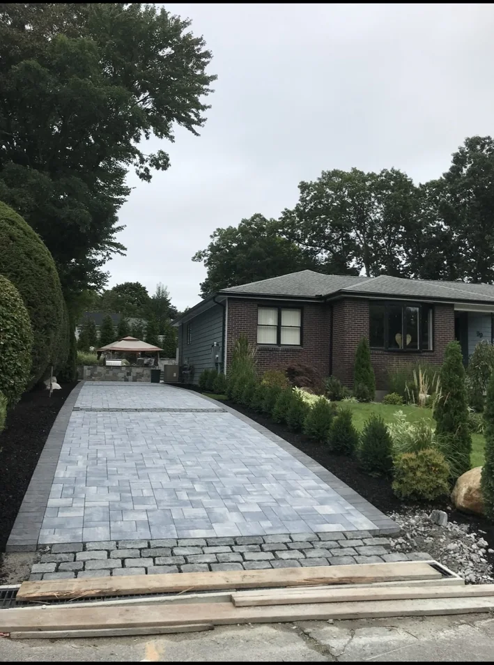 Long paver driveway with landscape border